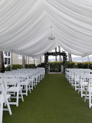 Wedding seating beneath a draped tent