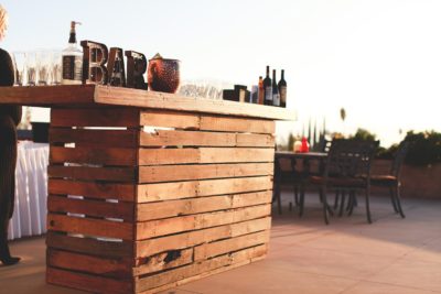 A rustic bar set with decorations on top.