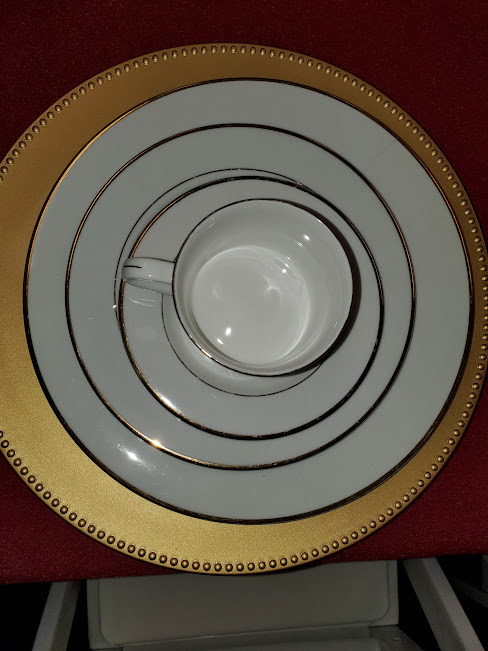White with gold band china set